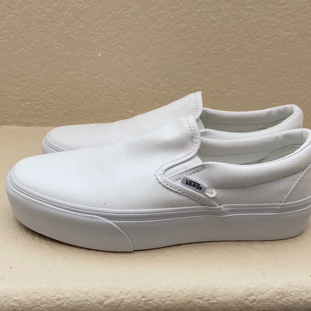 white platform slip on vans